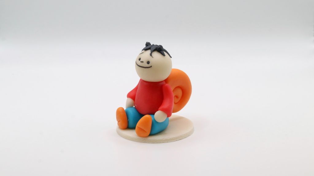 Csigafiú figura]